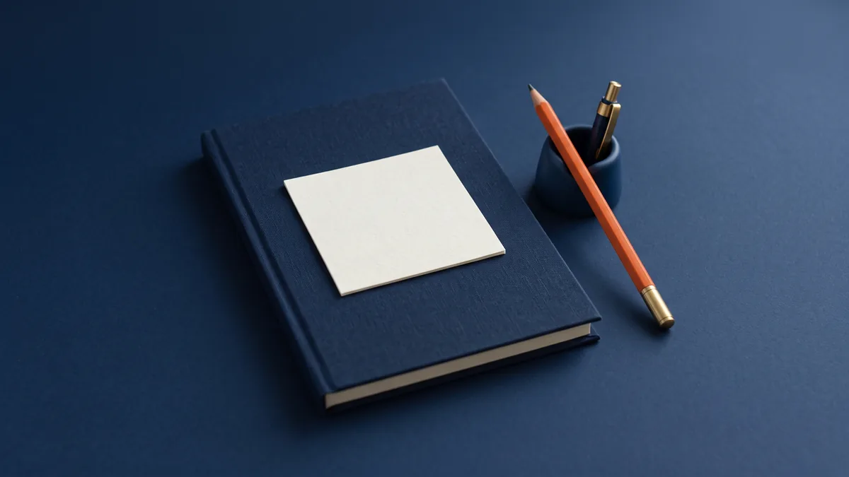 Blank sticky note on a notebook with an orange pencil, the cover image for A Small Tip for Bloggers