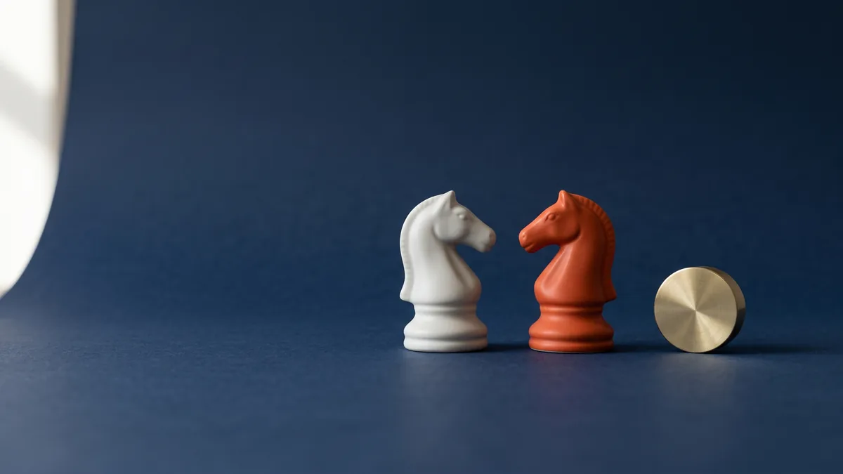 Two chess knights facing each other, the cover image for Admob vs. Kyle