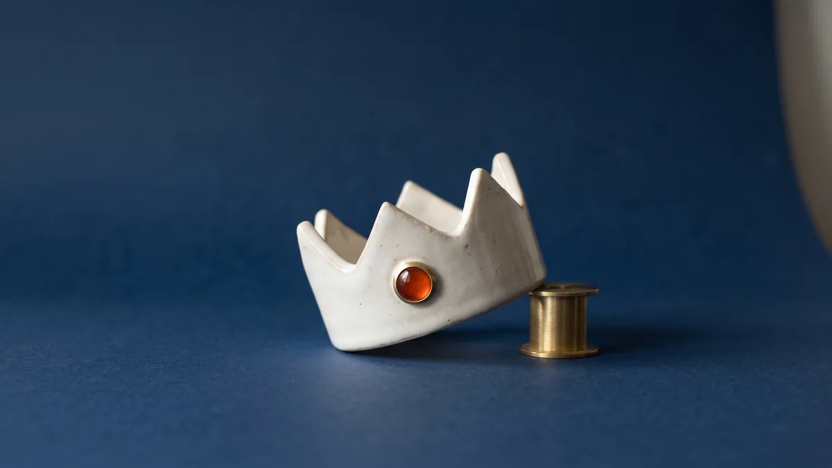 Ceramic crown with a single orange jewel, the cover image for All Hail WordPress 2.5…