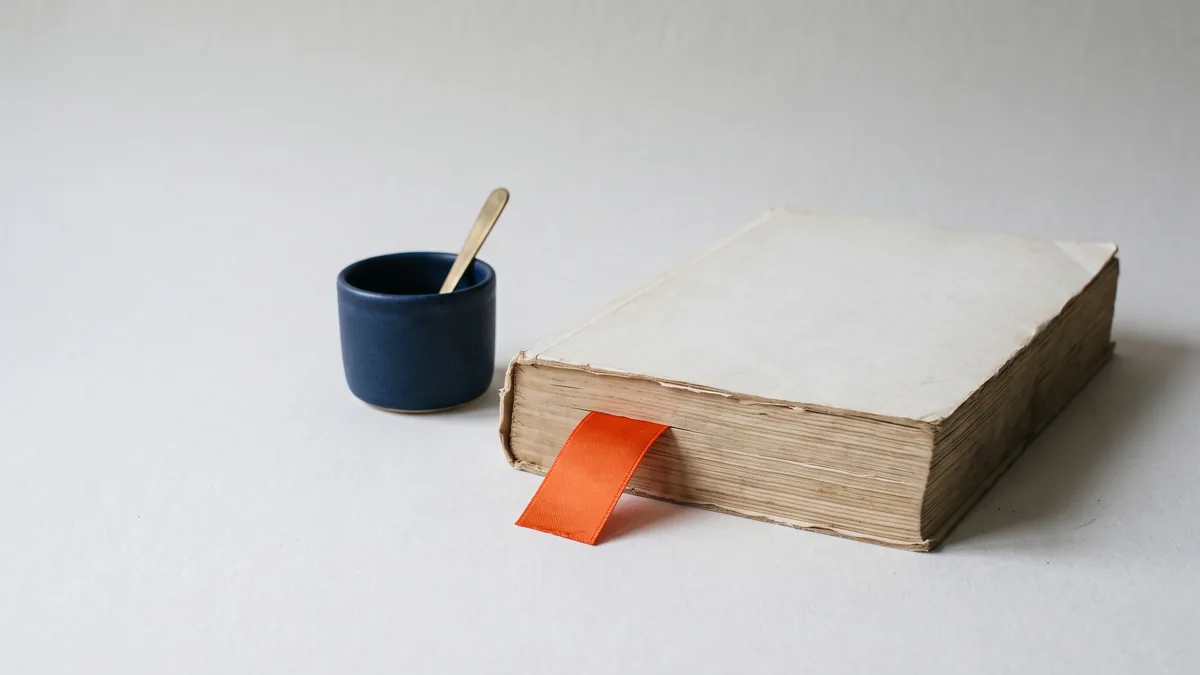 Thick old directory book with an orange bookmark, the cover image for Directories & Google: The Truth