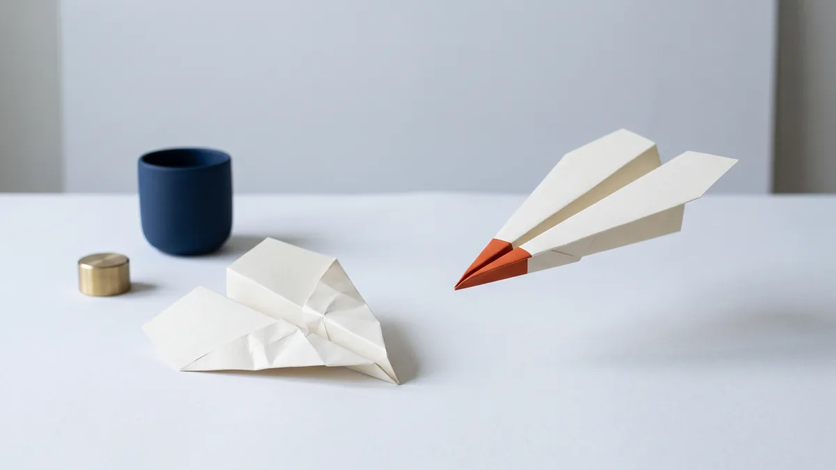 Two paper airplanes, one crumpled and one gliding, the cover image for Technology: What Makes Winners and Losers