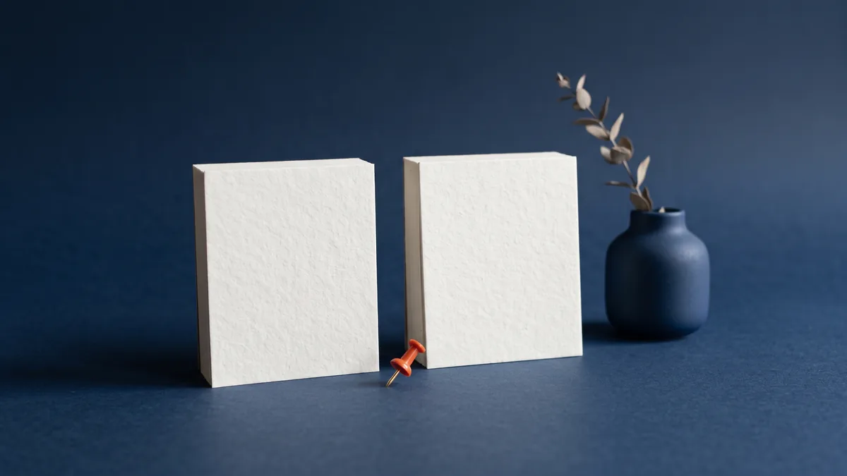 Two blank desk calendars with an orange push pin, the cover image for WM6.5 and WM7 Dates!