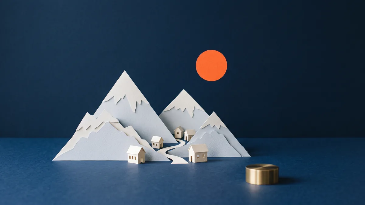 Paper craft mountains with tiny houses and an orange sun, the cover image for WordPress as an Economic Development Tool for Armenia