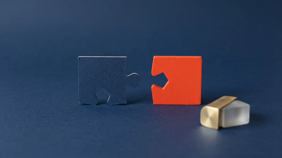 Two puzzle pieces that do not fit together, the cover image for Yahoo Says Yah-no to Microsoft